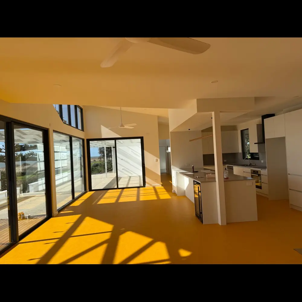 Finished open-plan kitchen and living area with coastal light
