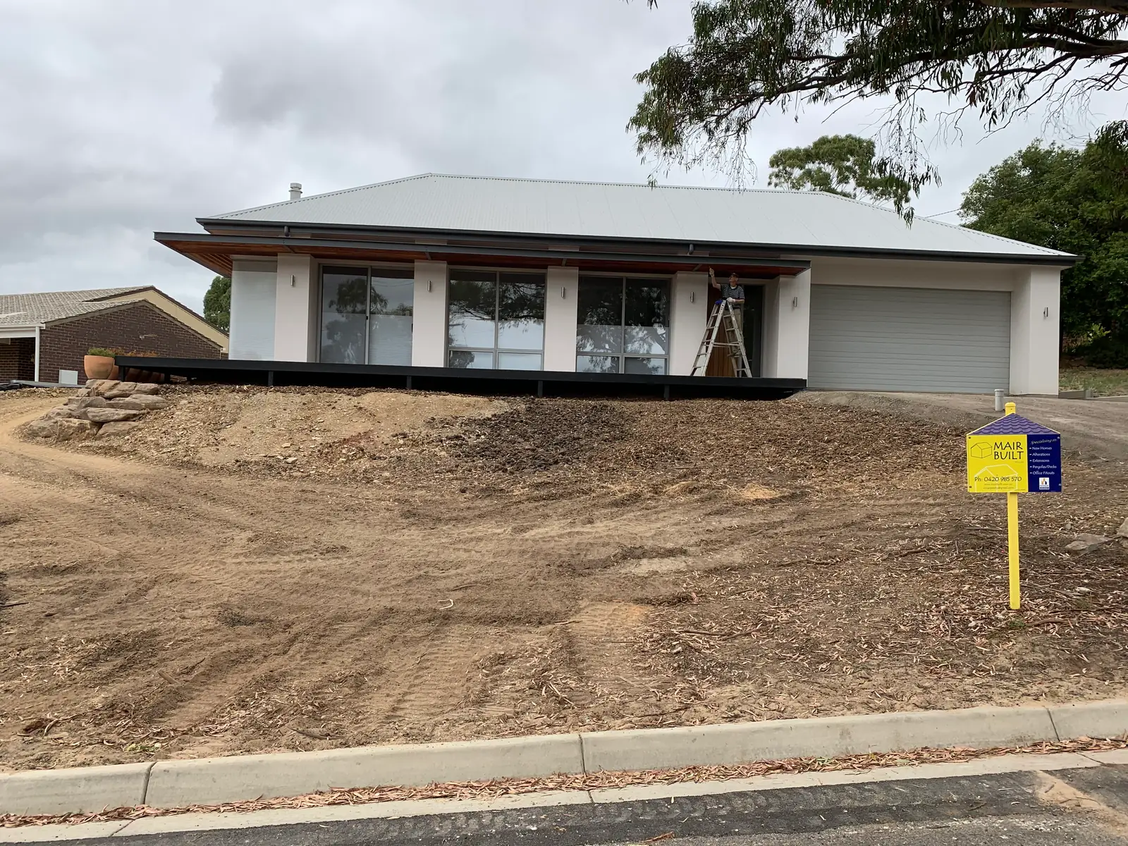 Completed single-storey home with skillion roof and double garage